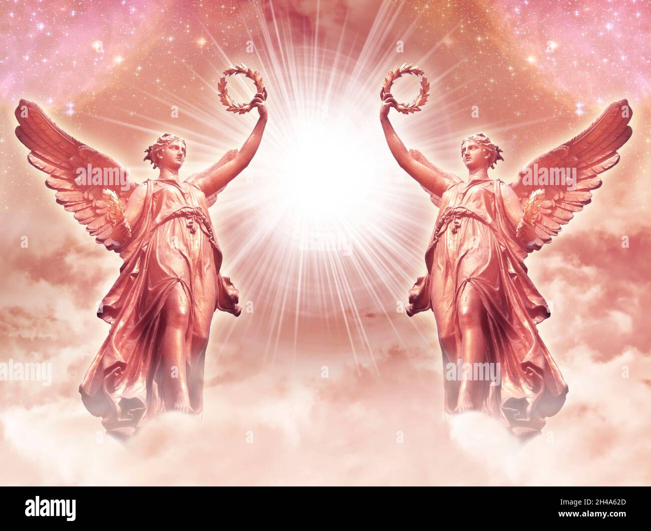two angels archangels with divine rays of light Stock Photo