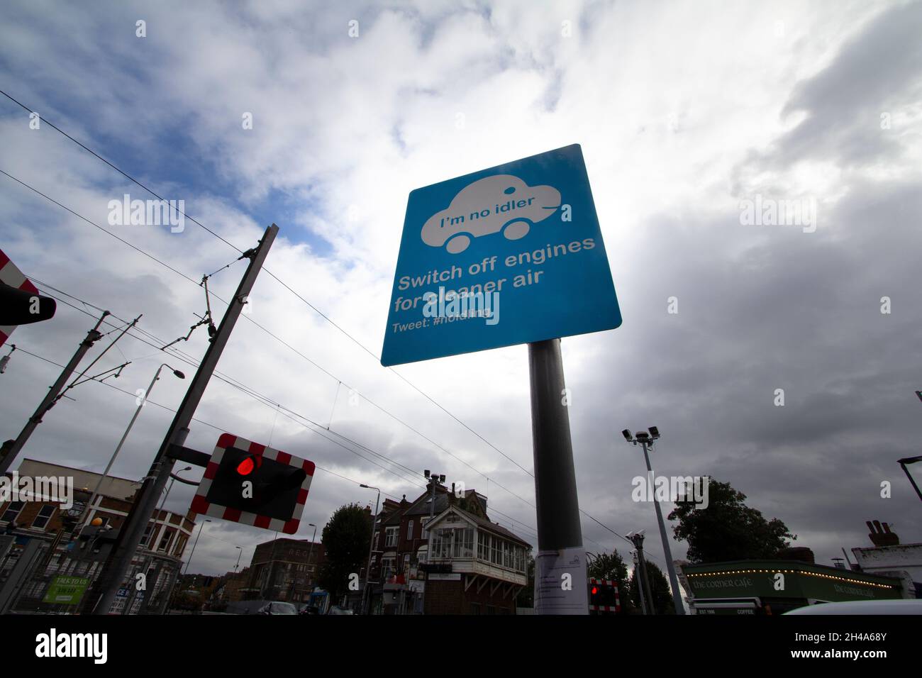Switch off engines for cleaner air sign, at railway crossing in Highams Park London, UK.Anti