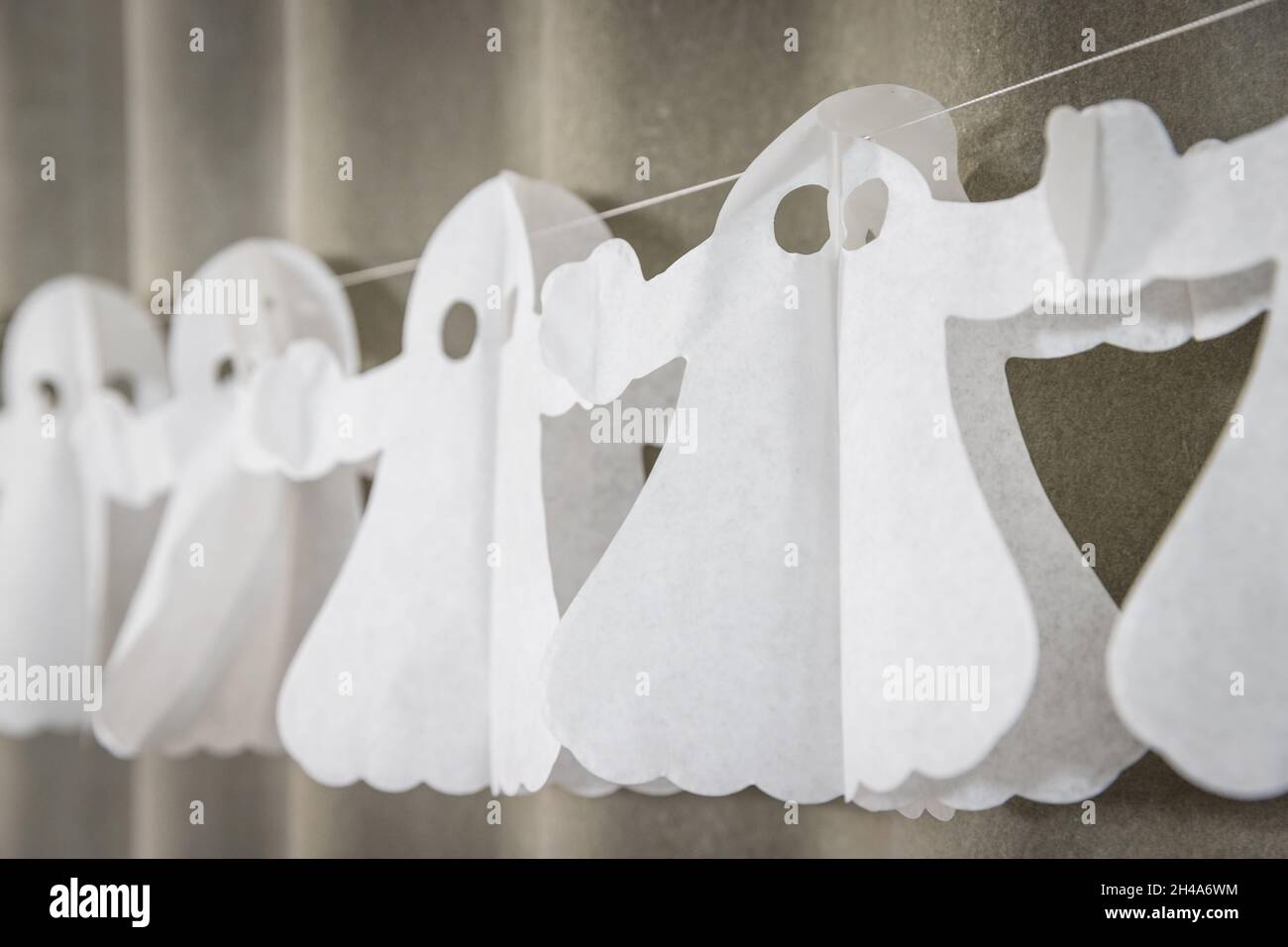 Halloween ghosts paper garland Stock Photo