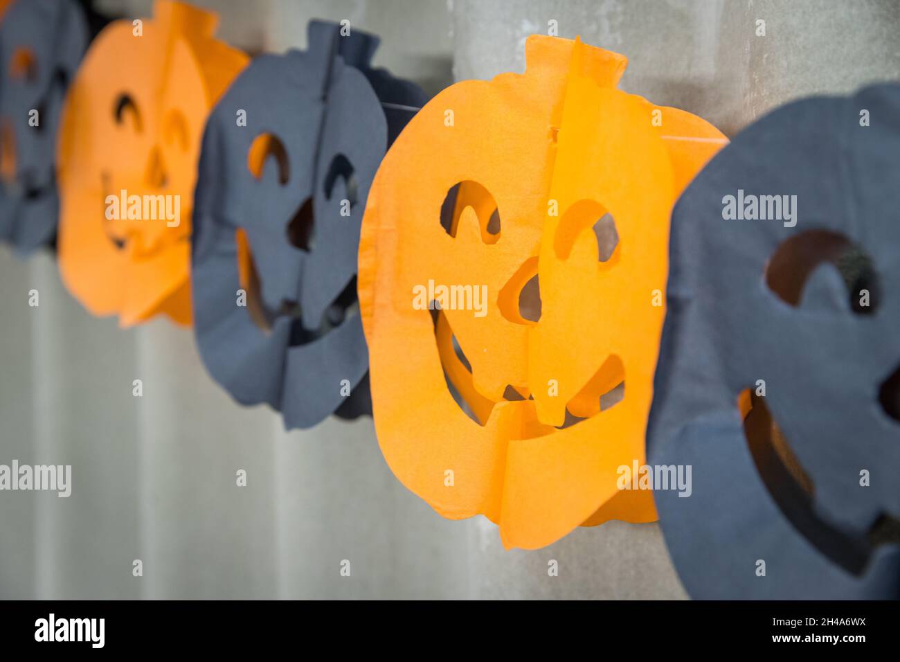 close up of halloween pumpkin paper garland Stock Photo