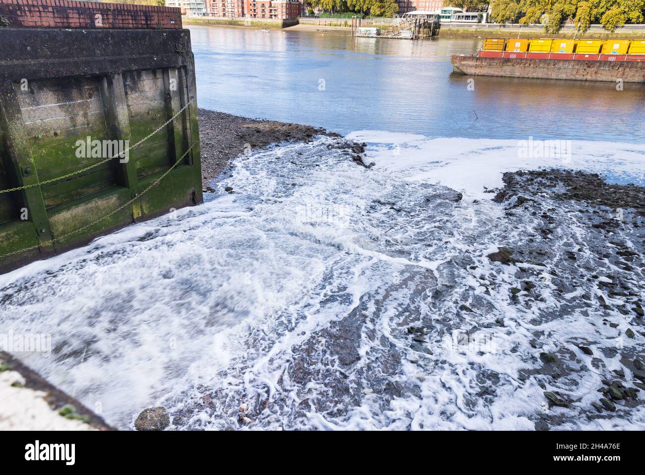 Sewer overflow being discharged in the Thames Stock Photo