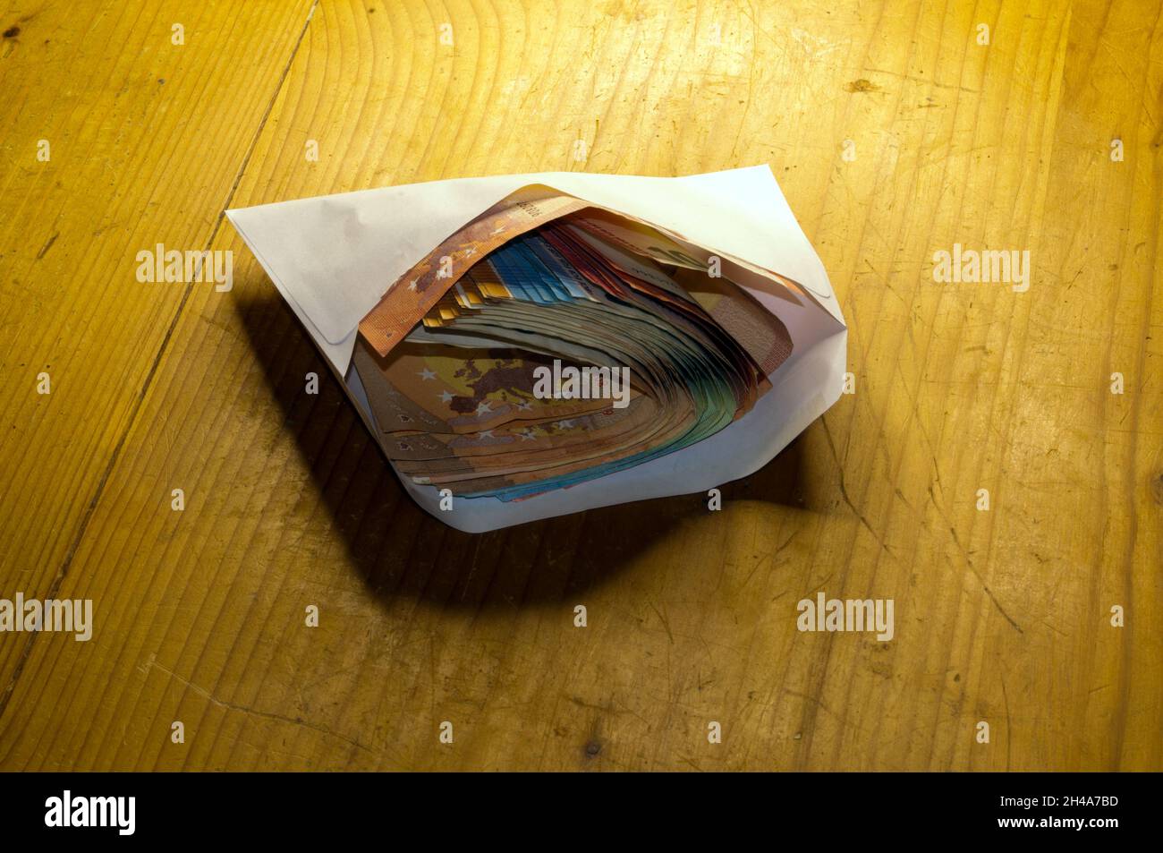 Money bundles, banknotes in a white envelope, isolated Stock Photo - Alamy