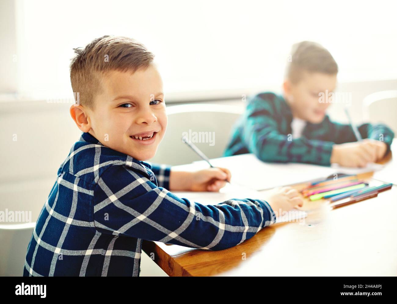 child boy homework school education classroom studying childhood home kid student learning writing Stock Photo