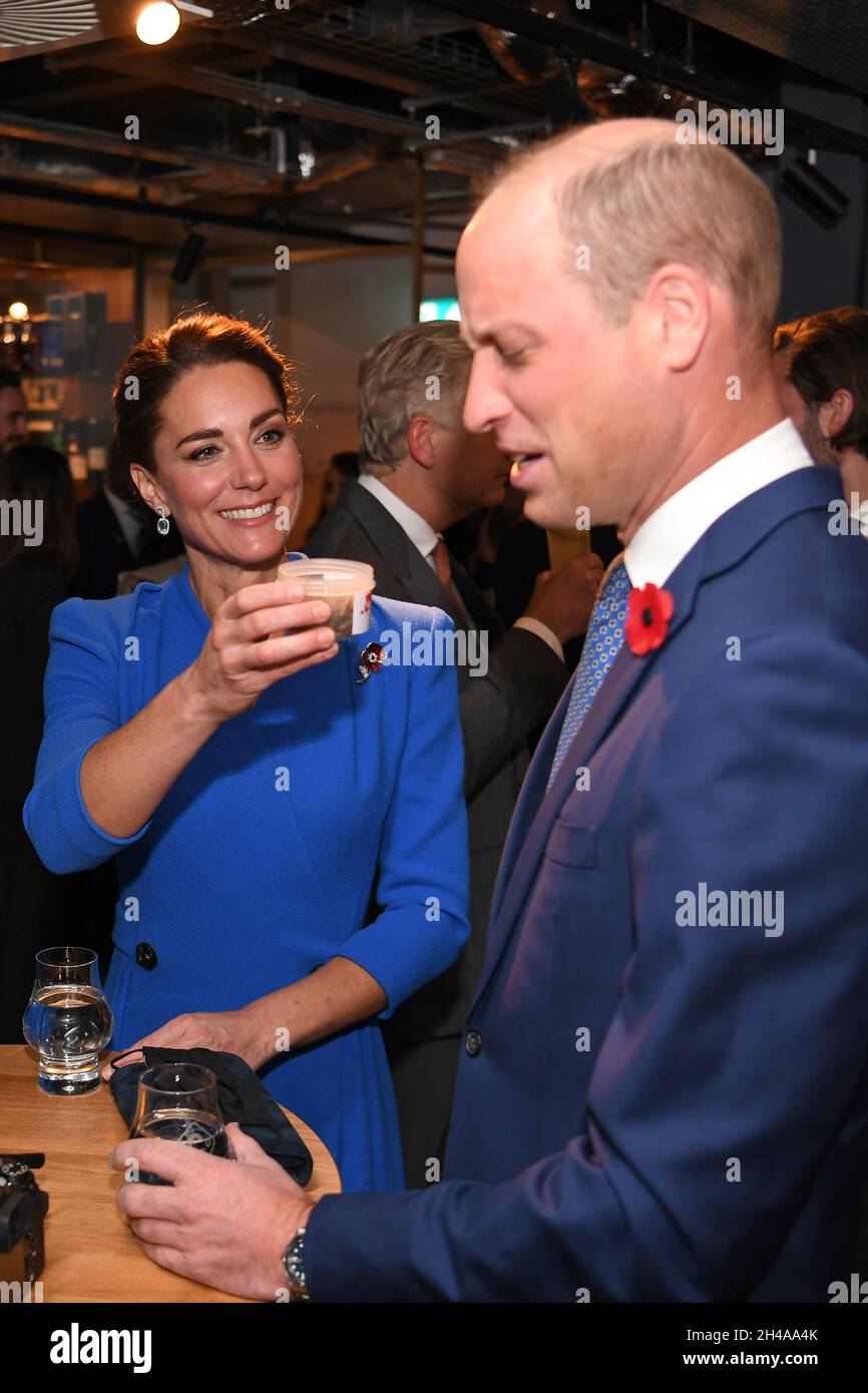 The Duchess of Cambridge (left) offers a tub of dead larvae, used as livestock feed, to her husband The Duke of Cambridge (right), while they speak with guests at a reception at the Clydeside Distillery, Glasgow, for the key members of the Sustainable Markets Initiative and the Winners and Finalists of the first Earthshot Prize Awards as the COP26 UN Climate Change Conference takes place in Glasgow. Picture date: Monday November 1, 2021. Stock Photo