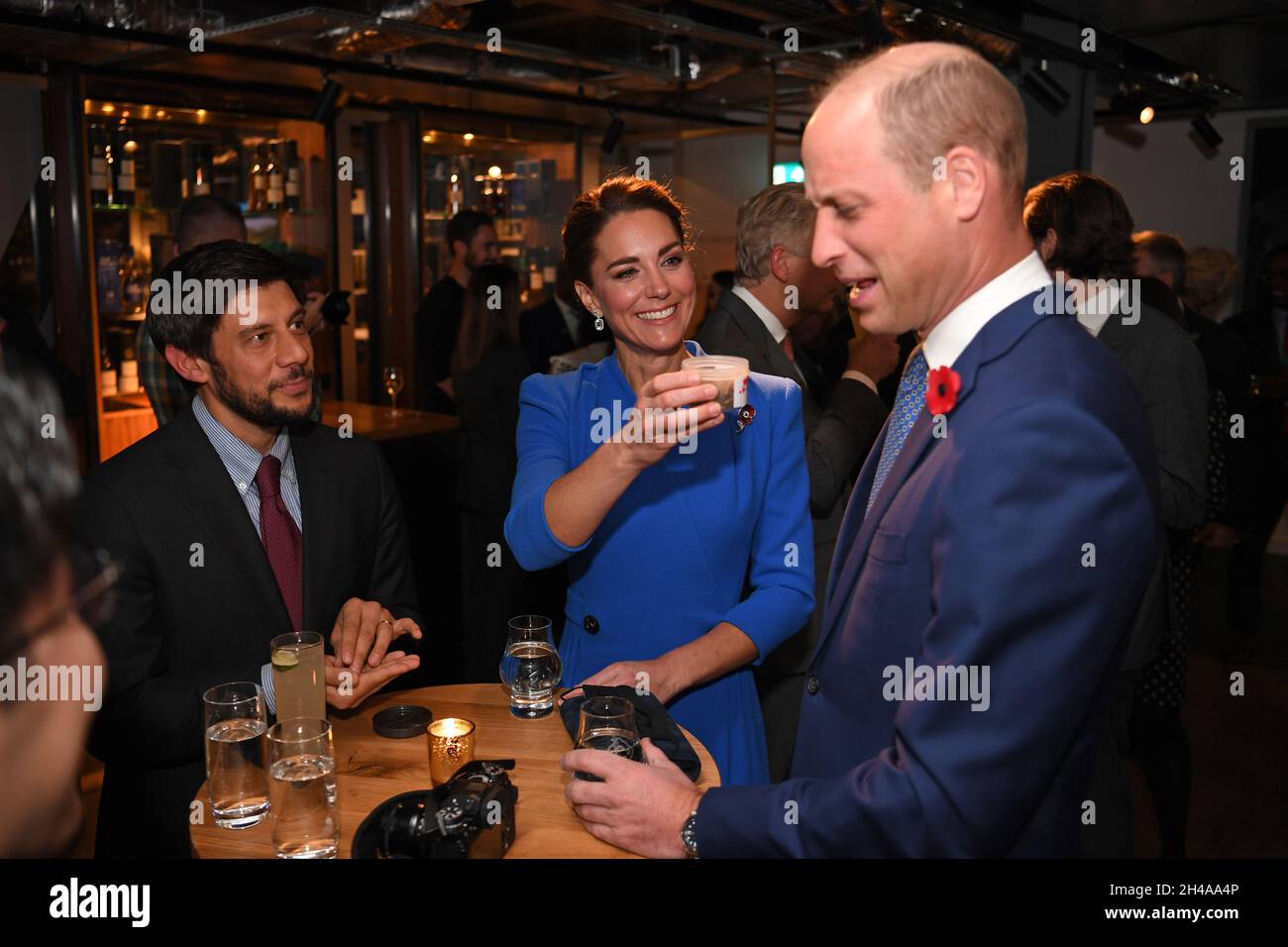 The Duchess of Cambridge (centre) offers a tub of dead larvae, used as livestock feed, to her husband The Duke of Cambridge (right), while they speak with guests at a reception at the Clydeside Distillery, Glasgow, for the key members of the Sustainable Markets Initiative and the Winners and Finalists of the first Earthshot Prize Awards as the COP26 UN Climate Change Conference takes place in Glasgow. Picture date: Monday November 1, 2021. Stock Photo