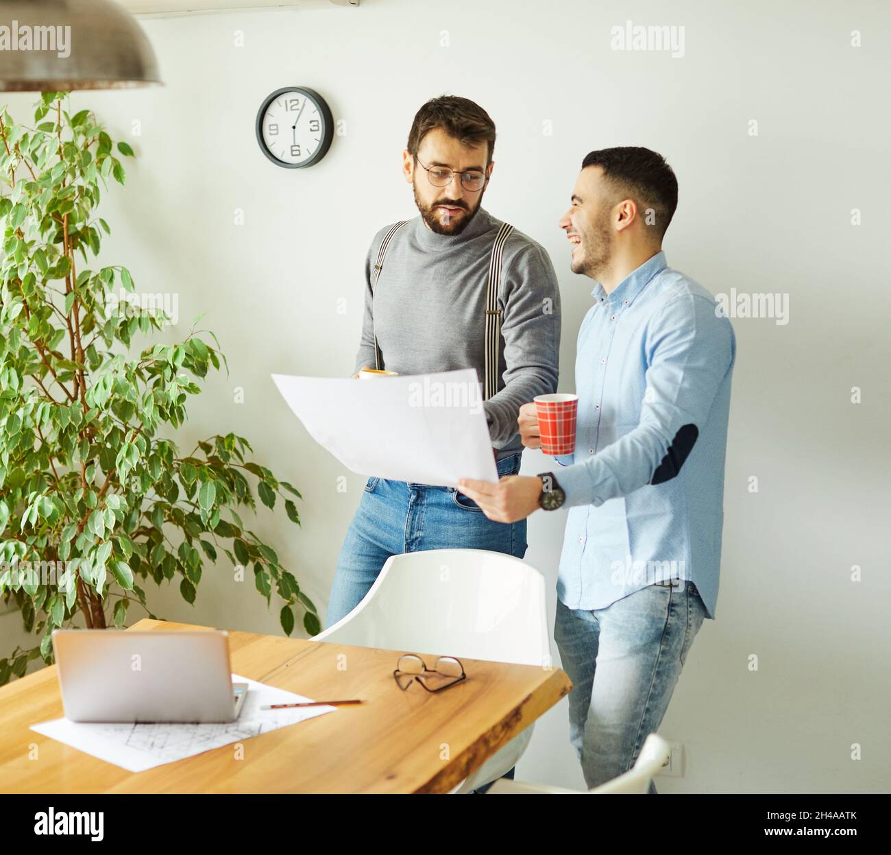 young business people meeting office teamwork happy success corporate discussion casual startup desk Stock Photo