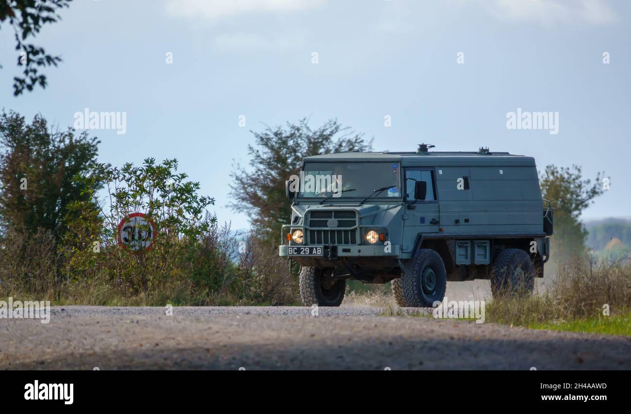 A British army Steyr-Daimler-Puch - BAE Systems Pinzgauer high-mobility 4x4 6WD 6-wheel drive all-terrain utility vehicle on a military exercise Stock Photo