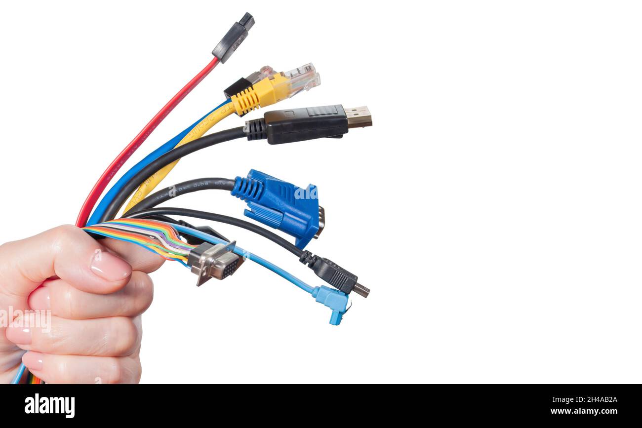 Bunch of computer cables in women's hand isolated on white background