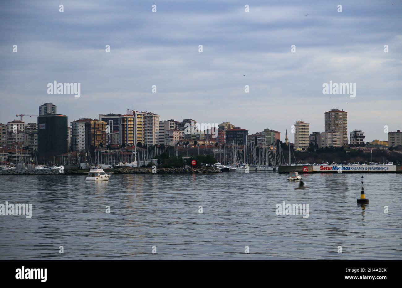 Cityscape on sea with cloudy sky Stock Photo