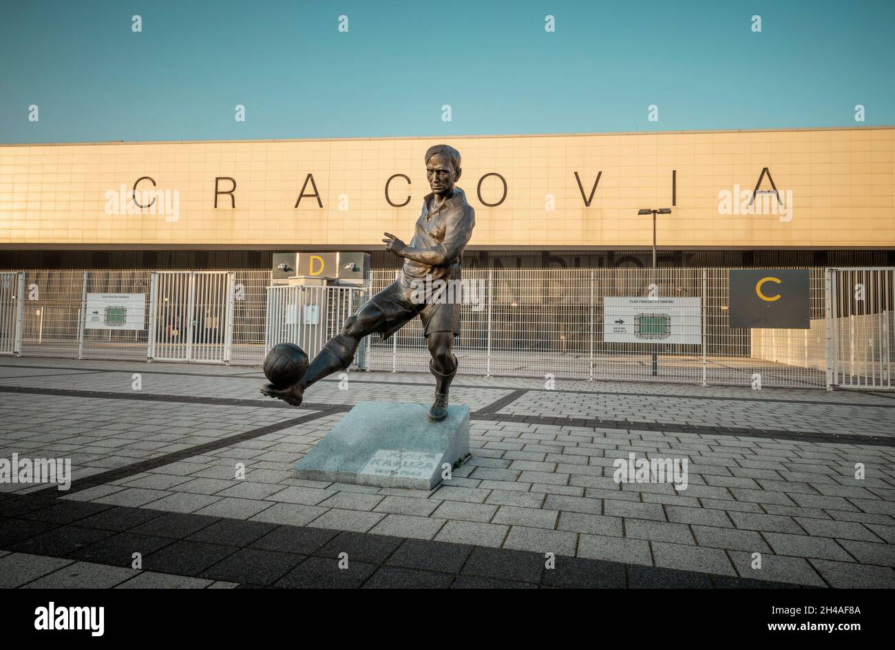 Krakow, Poland - October 29, 2021: Stadium of Cracovia Krakow football team and statue of Jozef Kaluza in Krakow, Poland Stock Photo