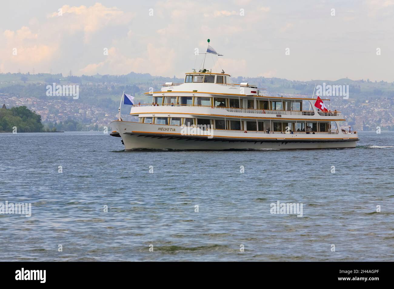 Rapperswil, Switzerland - May 10, 2016: MS Helvetia vessel arrives from Zurich to Rapperswill Ferry Terminal. The name Helvetia expresses the female n Stock Photo