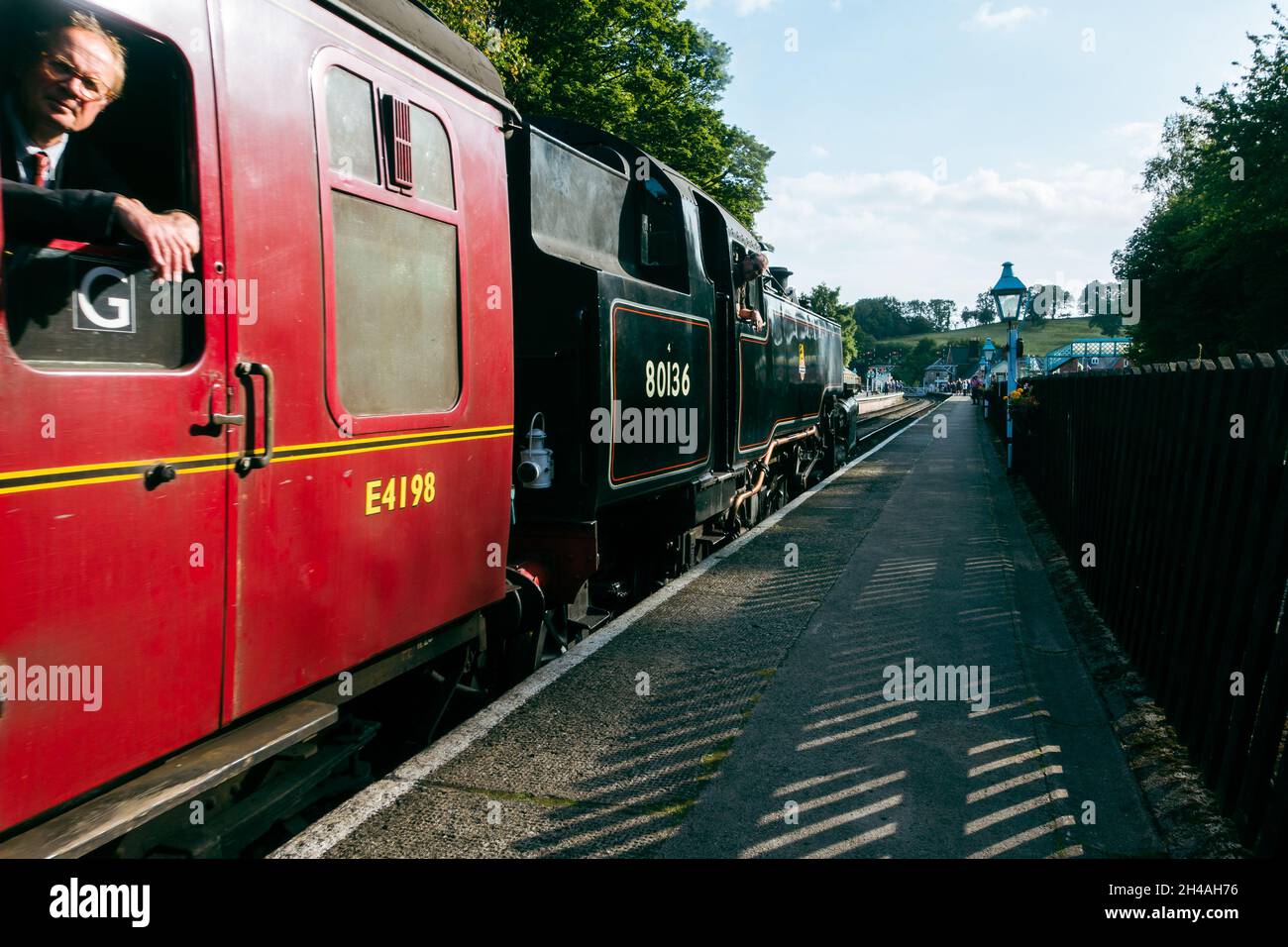 Steam train, The Moorlander,after filling up with water from the water tower heading to the main platform, Grosmont station on the North York Moors He Stock Photo