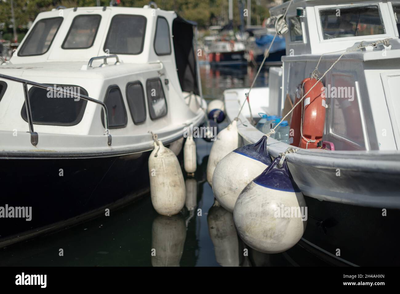 Standing in two boats hi-res stock photography and images - Alamy