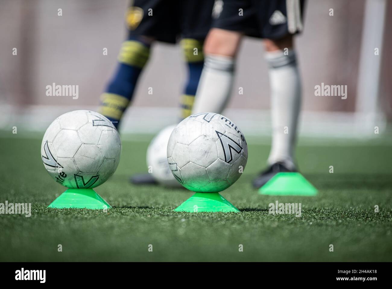unidentifiable children at grassroots football / soccer camp in UK Stock Photo