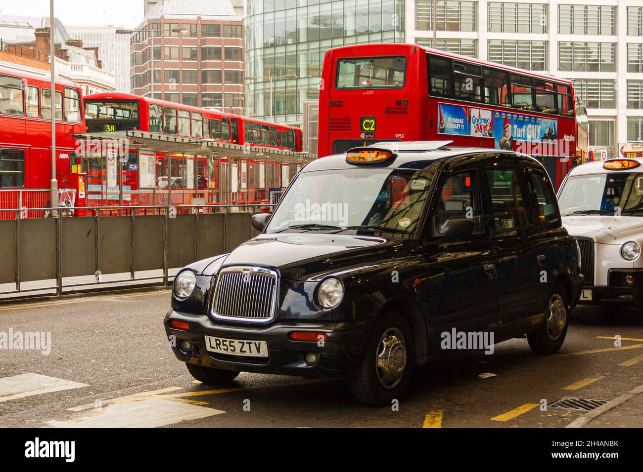 London, United Kingdom; March 15th 2011: Taxi and city buses at the Victoria railway station stop. Stock Photo