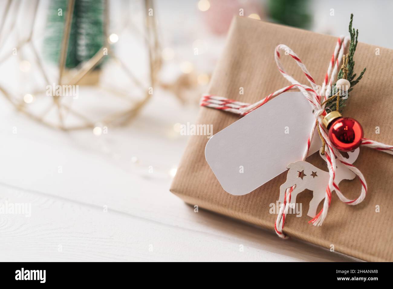 Free Gift With Purchase Christmas 2022 Merry Christmas And Happy New Year Gift With Tag 2022 Text. Glowing Snow  Bokeh. Winter Holidays On White Background. Zero Waste Present, Plastic Free  Stock Photo - Alamy