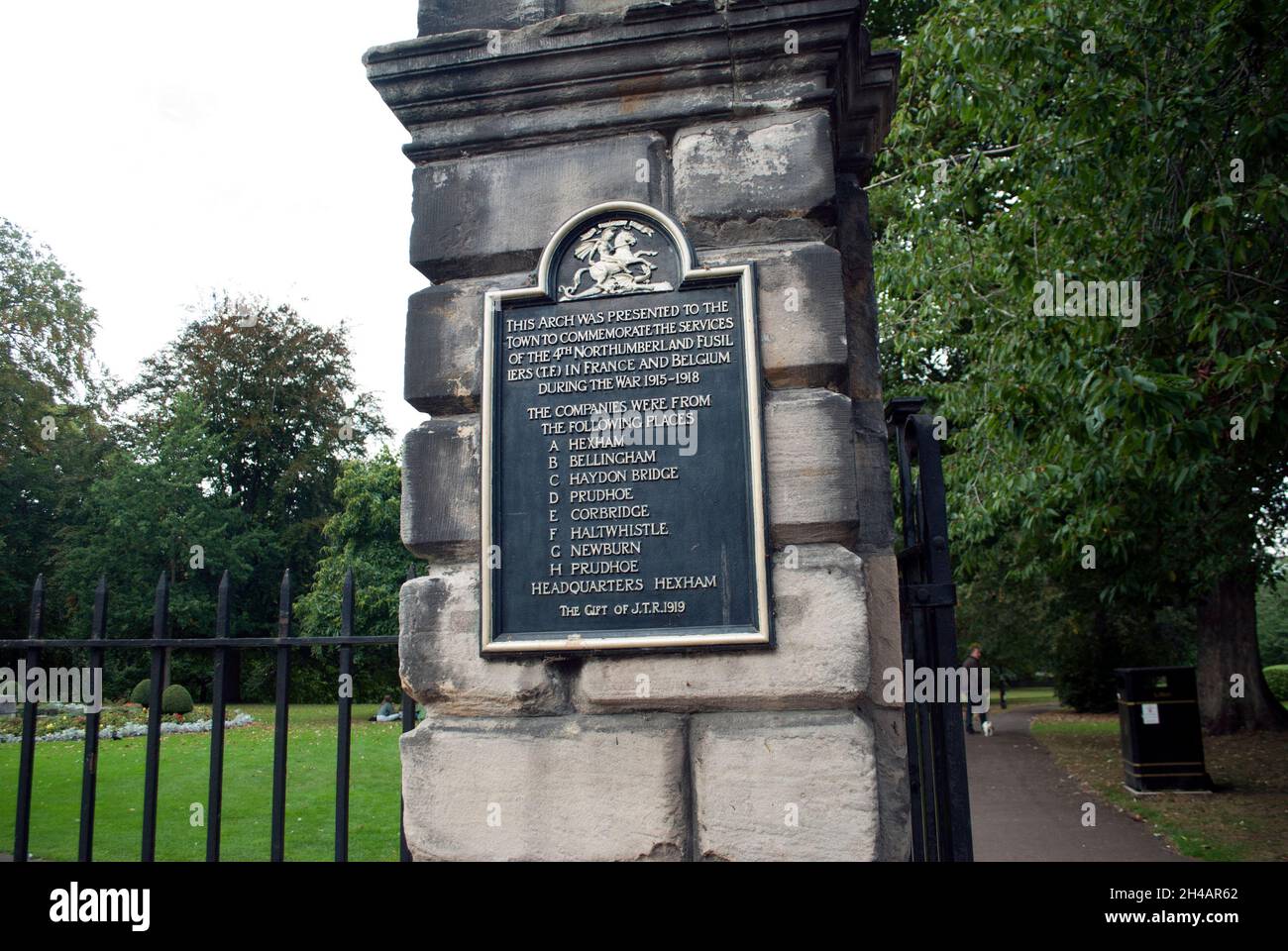 Bronze metal sign on stone commemorative arch entrance to Hexham Park ...