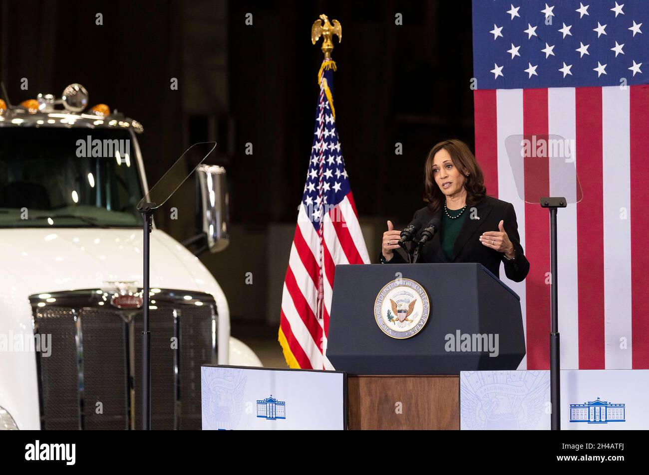 United States Vice President Kamala Harris speaks during an event promoting the Biden administration's Build Back Better agenda while standing in front electric tractor trailer trucks during an event in a Port Authority of New York and New Jersey hangar at John F. Kennedy International airport in the Queens borough of New York, New York, USA, 01 November 2021.Credit: Justin Lane/Pool via CNP /MediaPunch Stock Photo
