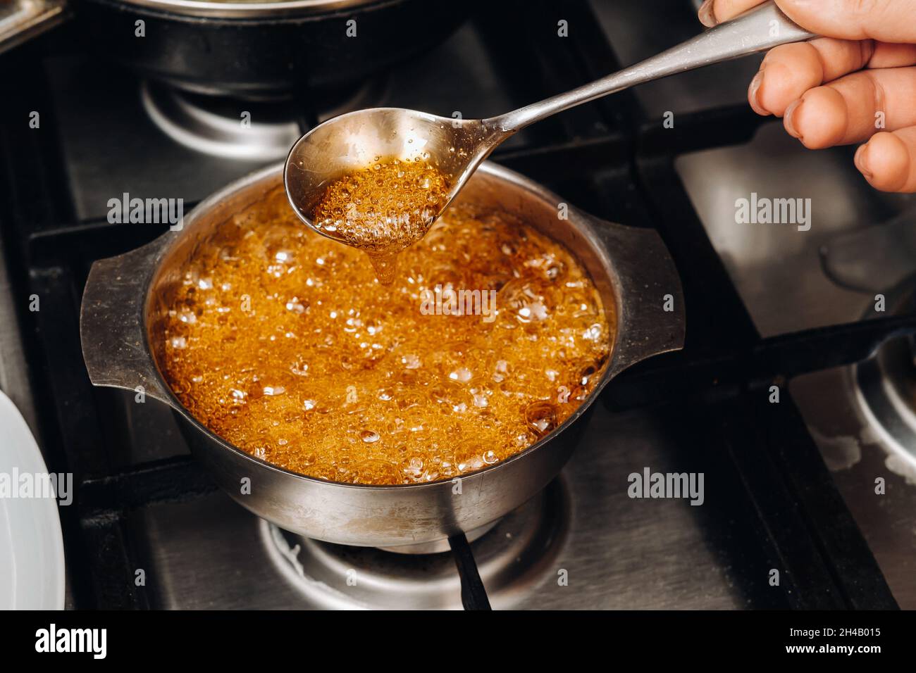 Preparation of sugar candies at home.A taste of our childhood.Rooster