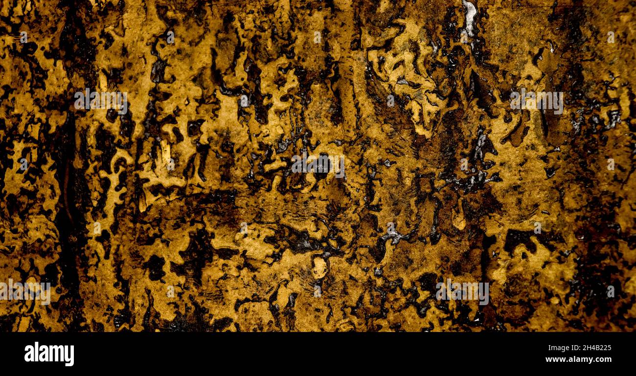 Abstract old crumpled ruberoid texture. Dark background with resin surface Stock Photo