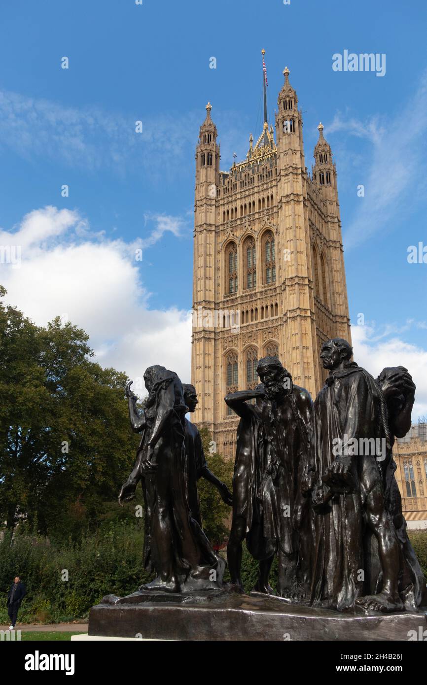 A cast of the 'Burghers of Calais' by Rodin stands in Victoria Tower Gardens close to the the Palace of Westminster, London, UK Stock Photo