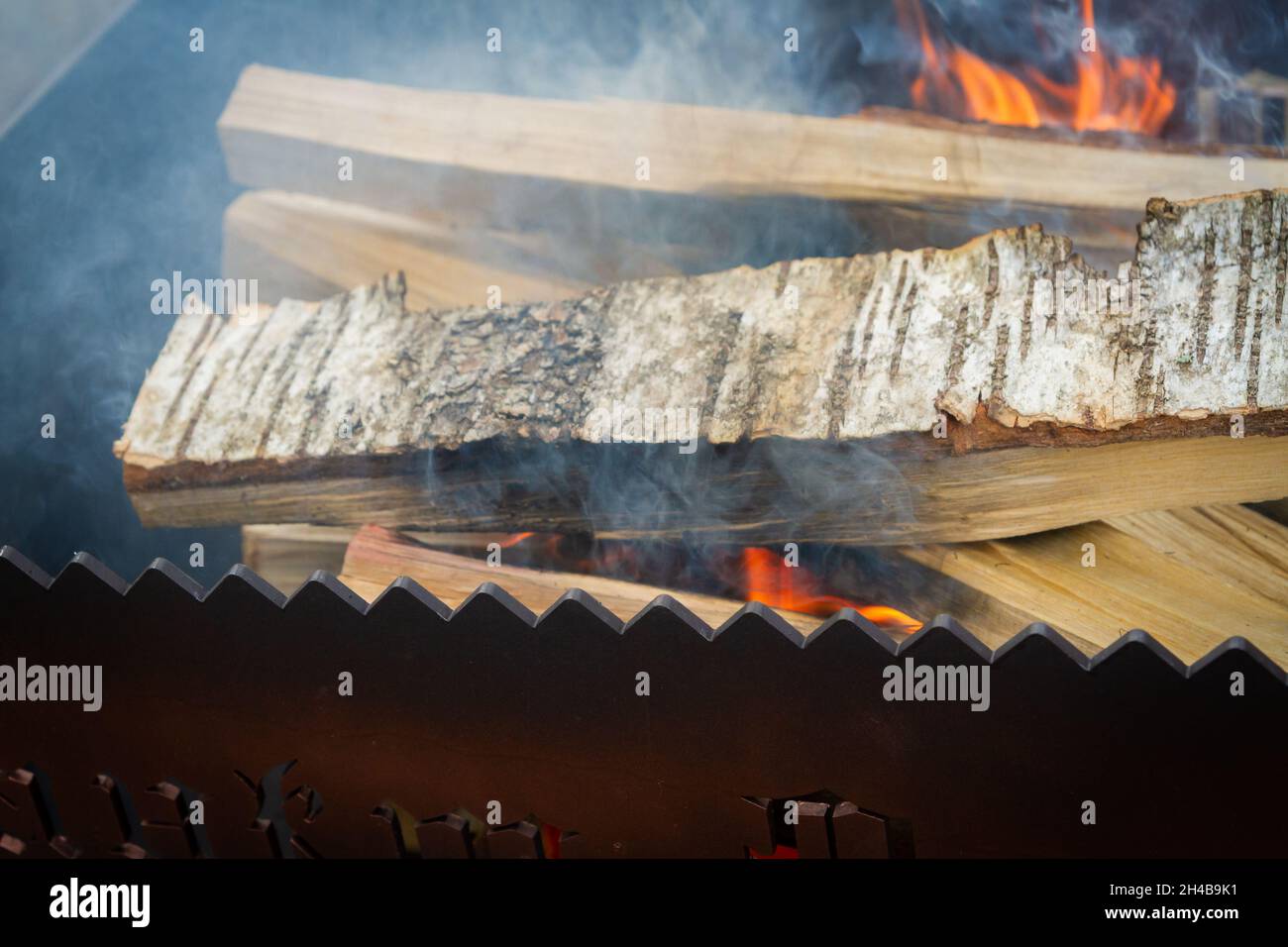 Dry wood in the grill for kindling and making coals Stock Photo Alamy