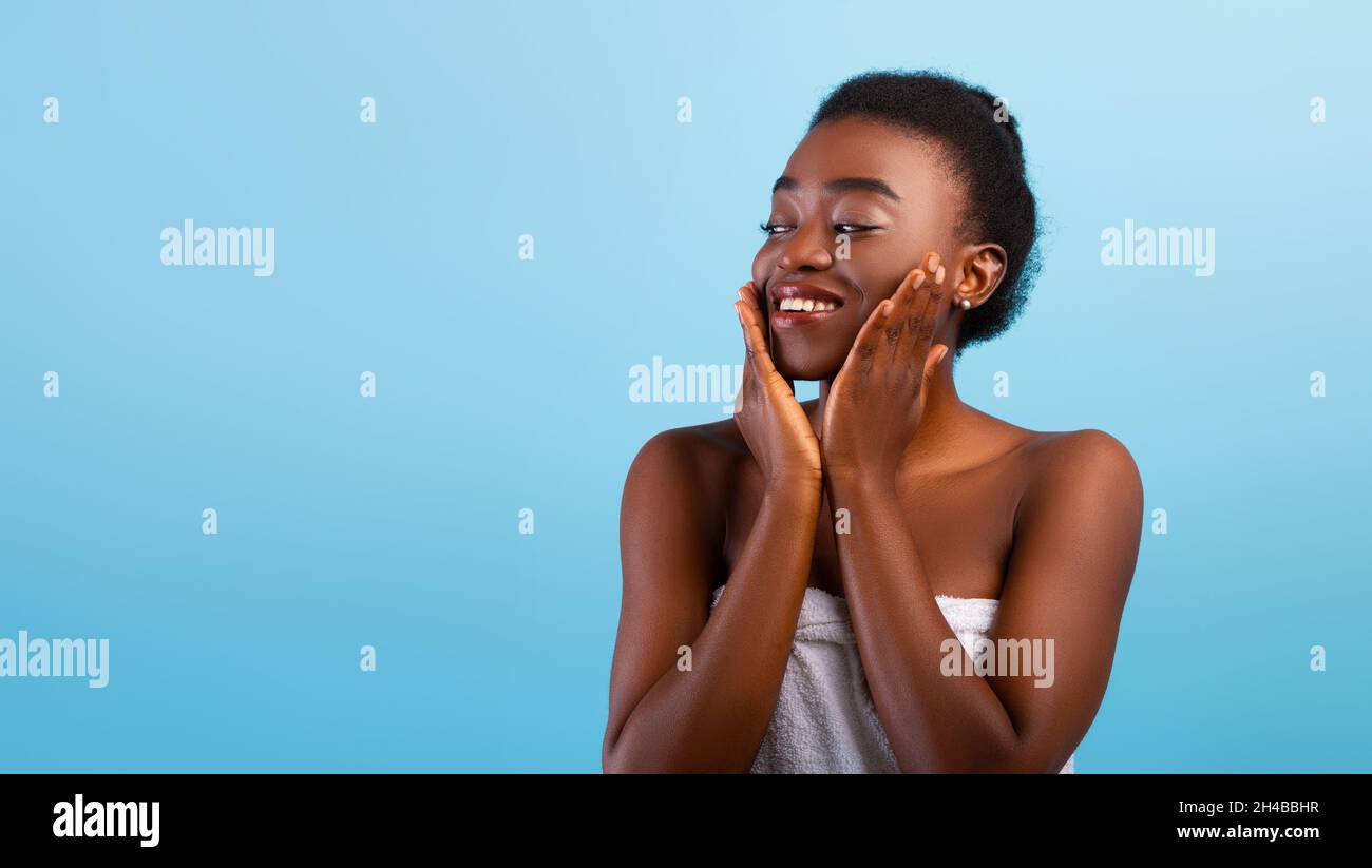 Face lifting concept. Happy african american lady touching soft smooth ...