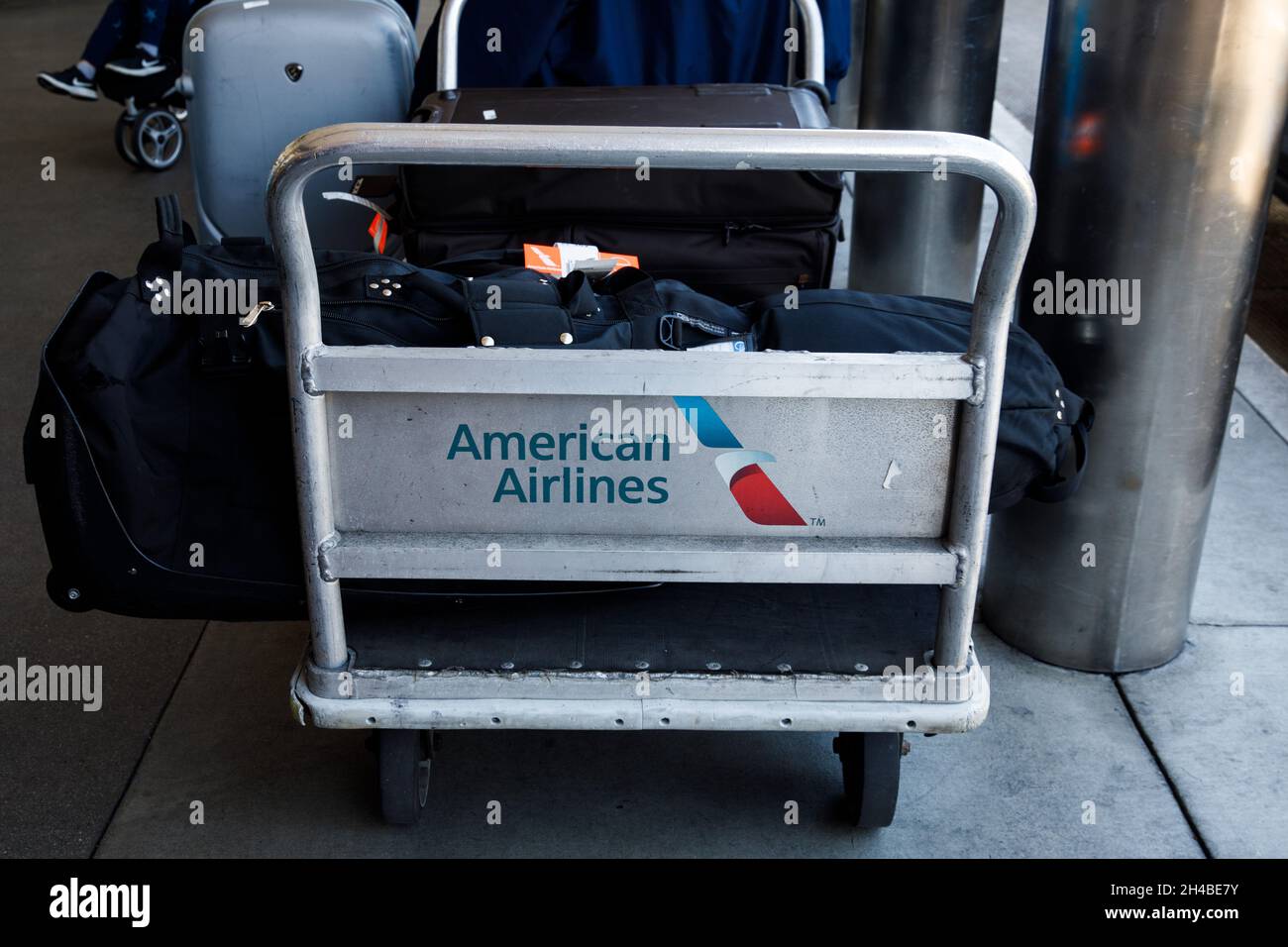 Los Angeles, California, USA. 29th Mar, 2019. An American Airlines Group Inc. baggage cart outside check-in at Los Angeles International Airport (LAX) on Friday, March 29, 2019 in Los Angeles, Calif. © 2019 Patrick T. Fallon (Credit Image: © Patrick Fallon/ZUMA Press Wire) Stock Photo