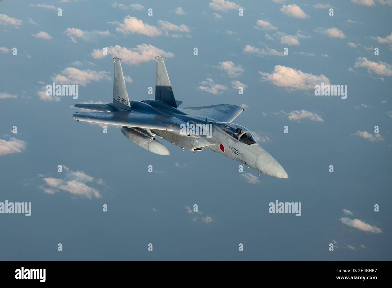 A Japan Air Self-Defense Force F-15J Eagle flies over the Pacific Ocean during Exercise Southern Beach, Oct. 28, 2021. This was the first time since the inception of Southern Beach in which the majority of the mission sets and a Japan-U.S. training program were conducted during night time hours. (U.S. Air Force photo by Staff Sgt. Savannah L. Waters) Stock Photo