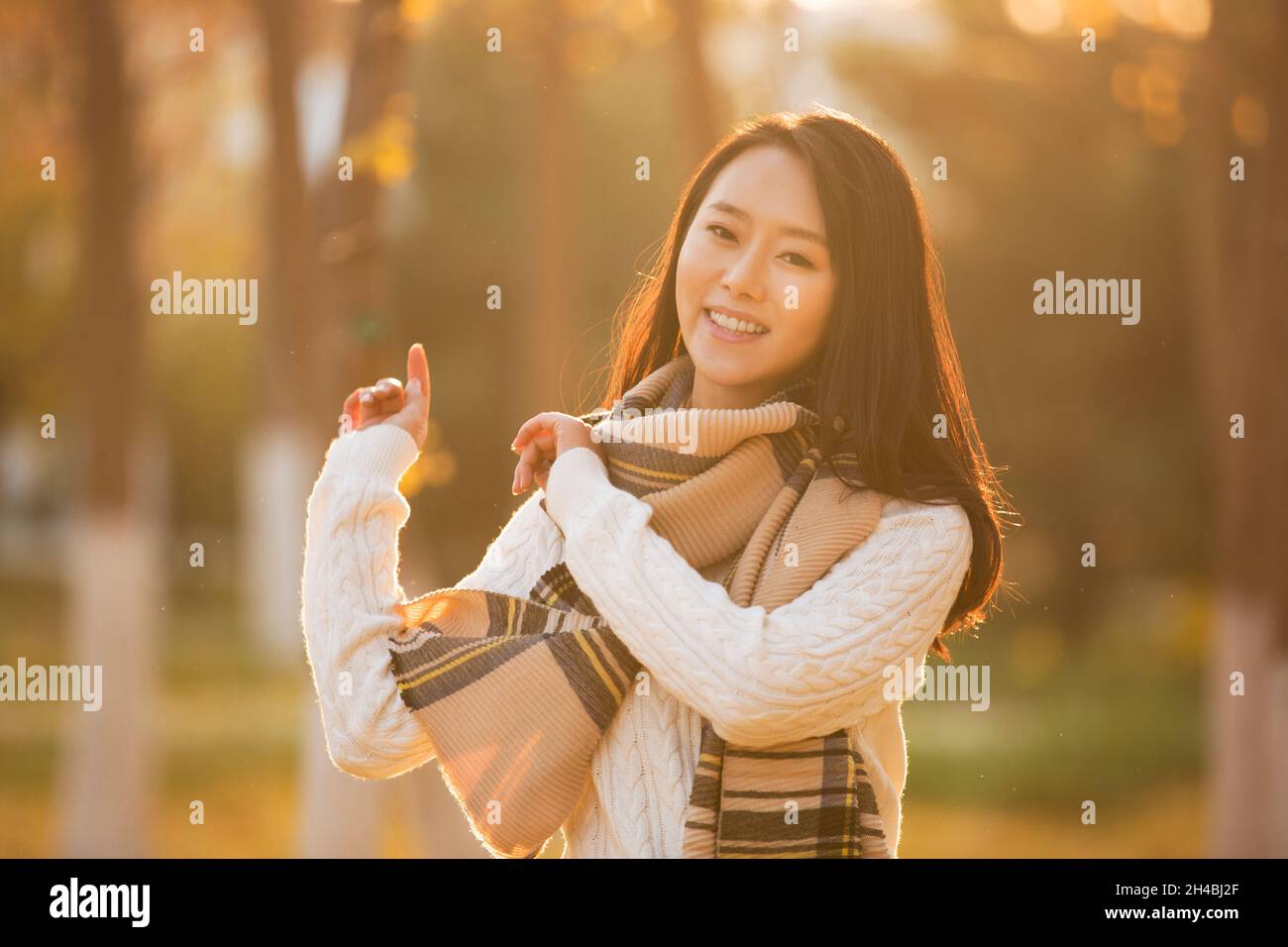 Happy young woman in autumn hi-res stock photography and images - Alamy