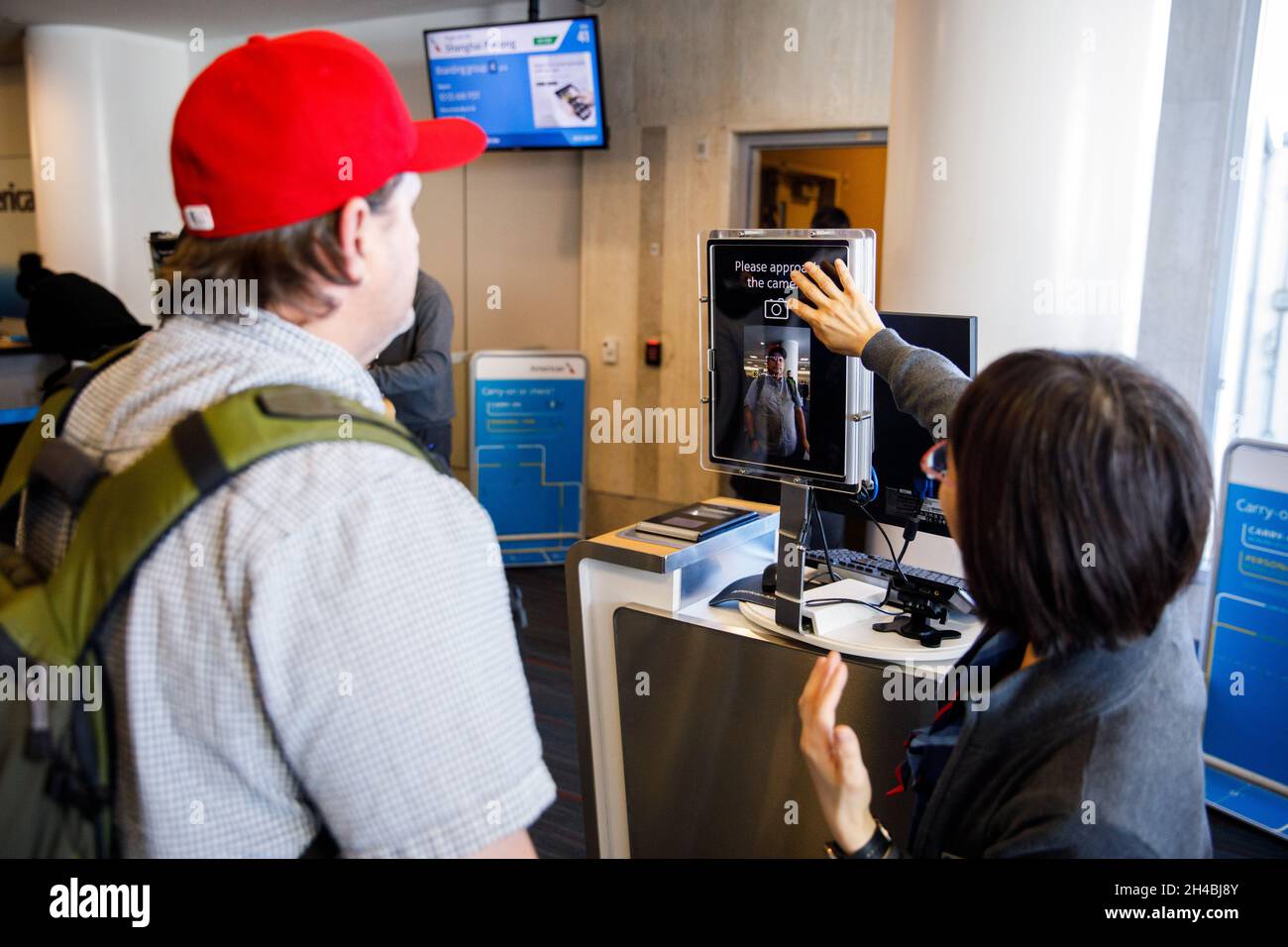 Los Angeles, California, USA. 29th Mar, 2019. Gate agents assist passengers using facial