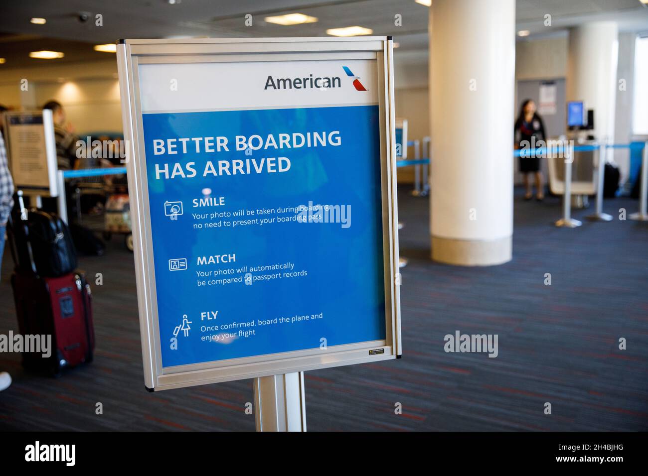Los Angeles, California, USA. 29th Mar, 2019. Gate agents assist passengers using facial