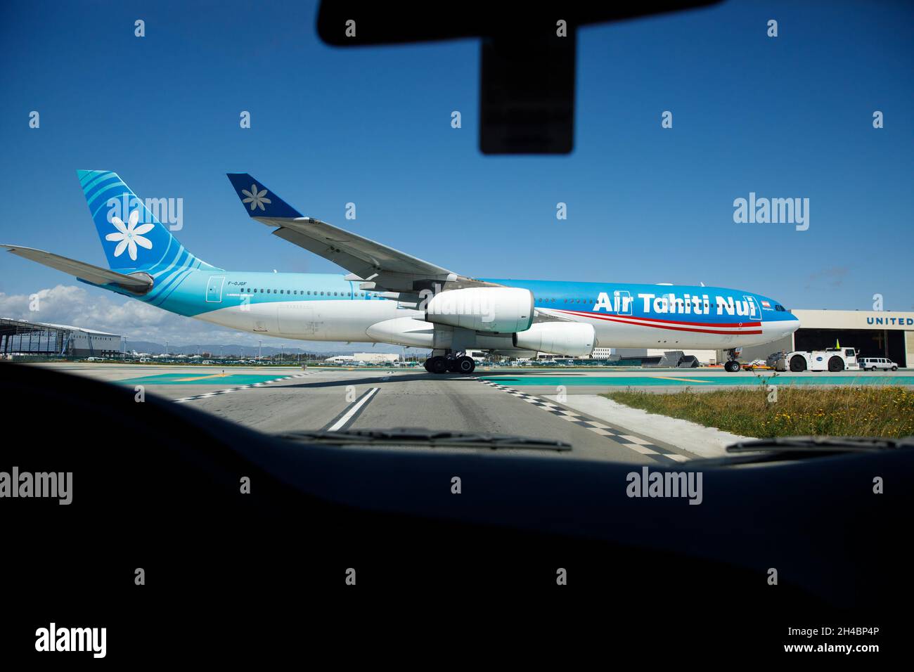 Los Angeles, California, USA. 28th Mar, 2019. An Air Tahiti Nui Airbus A340-300 (Registration F-OJGF) on the tarmac at Los Angeles International Airport (LAX) on Thursday, March 28, 2019 in Los Angeles, Calif. © 2019 Patrick T. Fallon (Credit Image: © Patrick Fallon/ZUMA Press Wire) Stock Photo