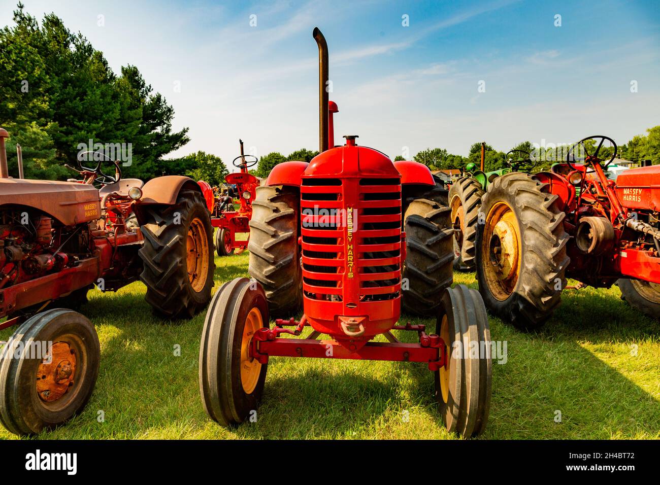 A red antique Massey Harris farm tractor on display at a tractor show in Warren, Indiana, USA. Stock Photo