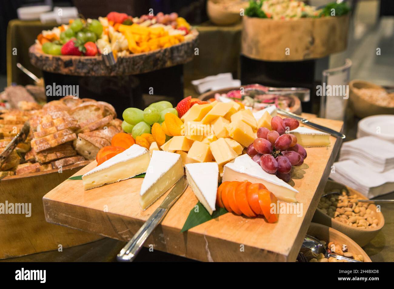 A cheese buffet is set up at an event Stock Photo Alamy