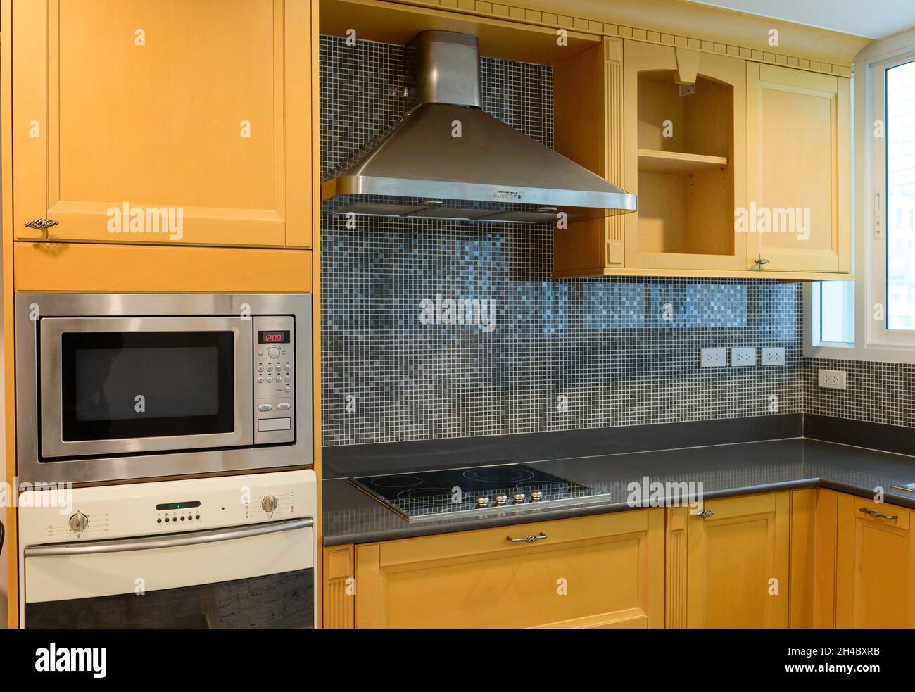 Kitchen interior with wooden cabinets Stock Photo - Alamy