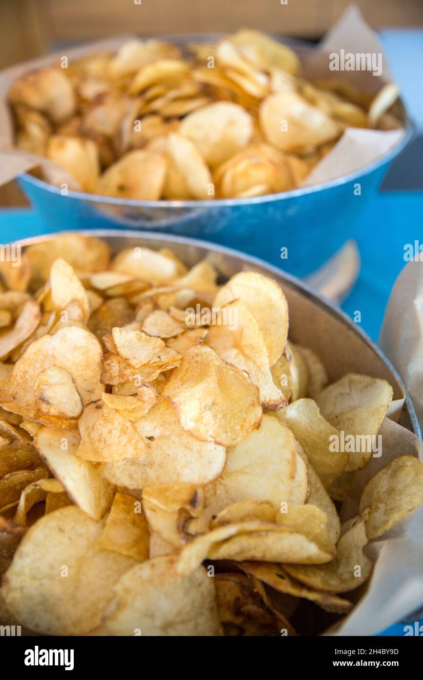 Bowl of potato chips served at a party. Stock Photo