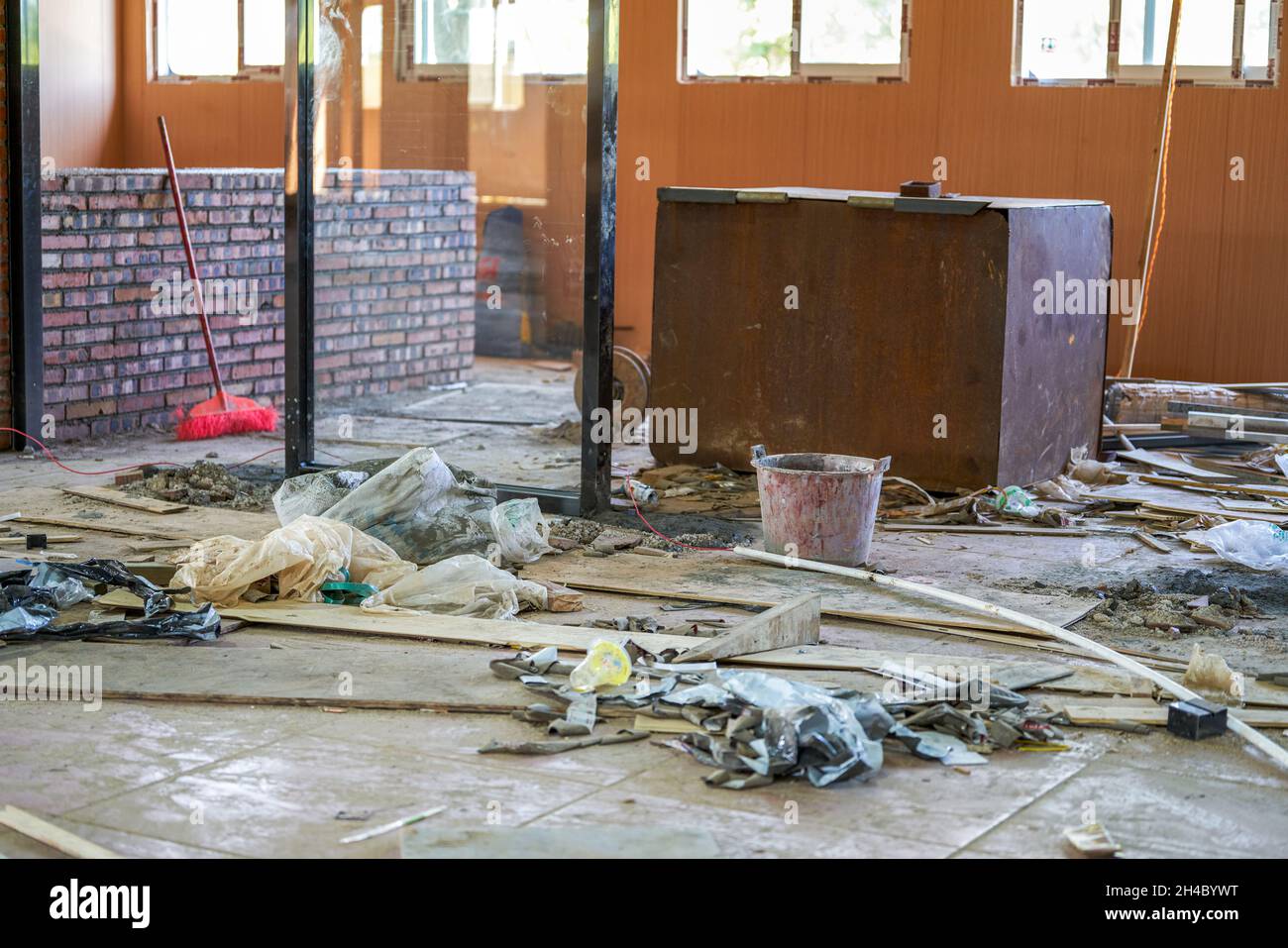 A close-up of a commercial storefront being renovated on a construction