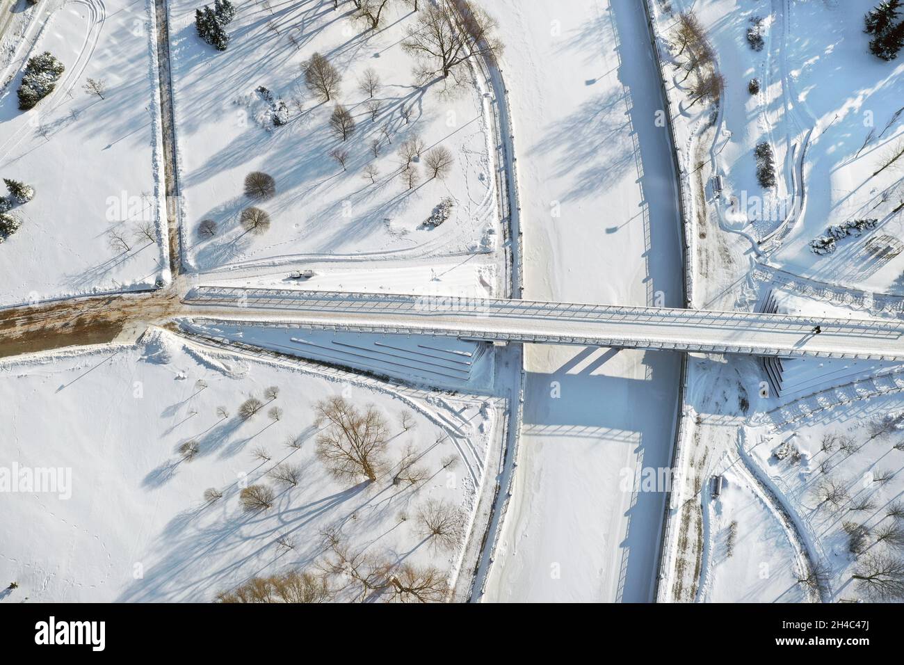 Top view of the pedestrian bridge over the frozen Svisloch river in Minsk. Belarus. Stock Photo