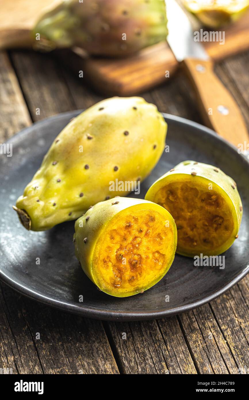 Raw prickly pears. Opuntia or indian fig cactus on plate. Stock Photo
