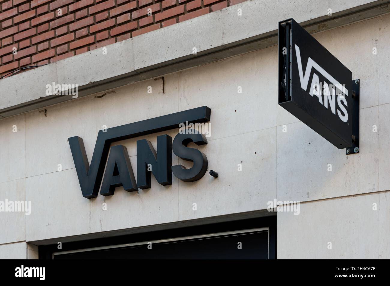 VALENCIA, SPAIN - OCTOBER 26, 2021: Vans is an American manufacturer of skateboarding shoes and related apparel Stock Photo