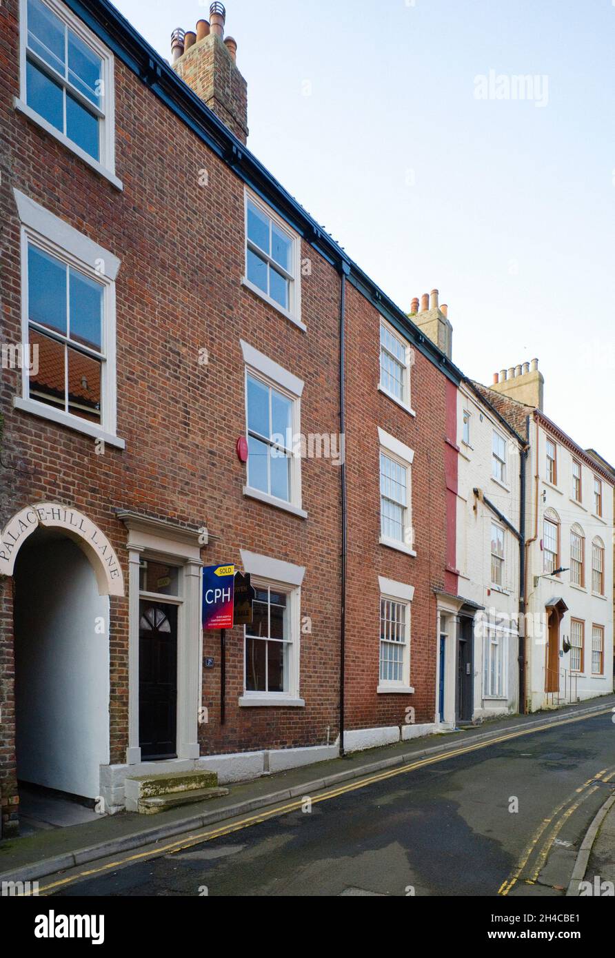 Grade II listed town houses built in 1818 during the reign of