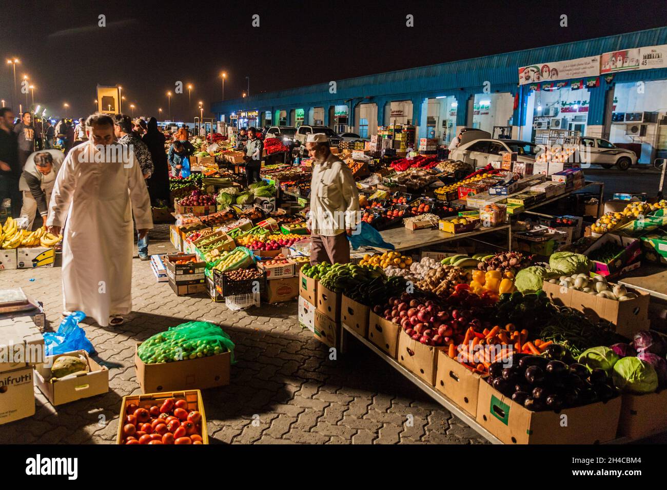 ABU DHABI, UAE MARCH 9, 2017 Night view of fruit and vegetable stalls at Al Mina market in ABU DHABI, UAE MARCH 9, 2017 Night view of fruit and vegetable stalls at Al Mina market in