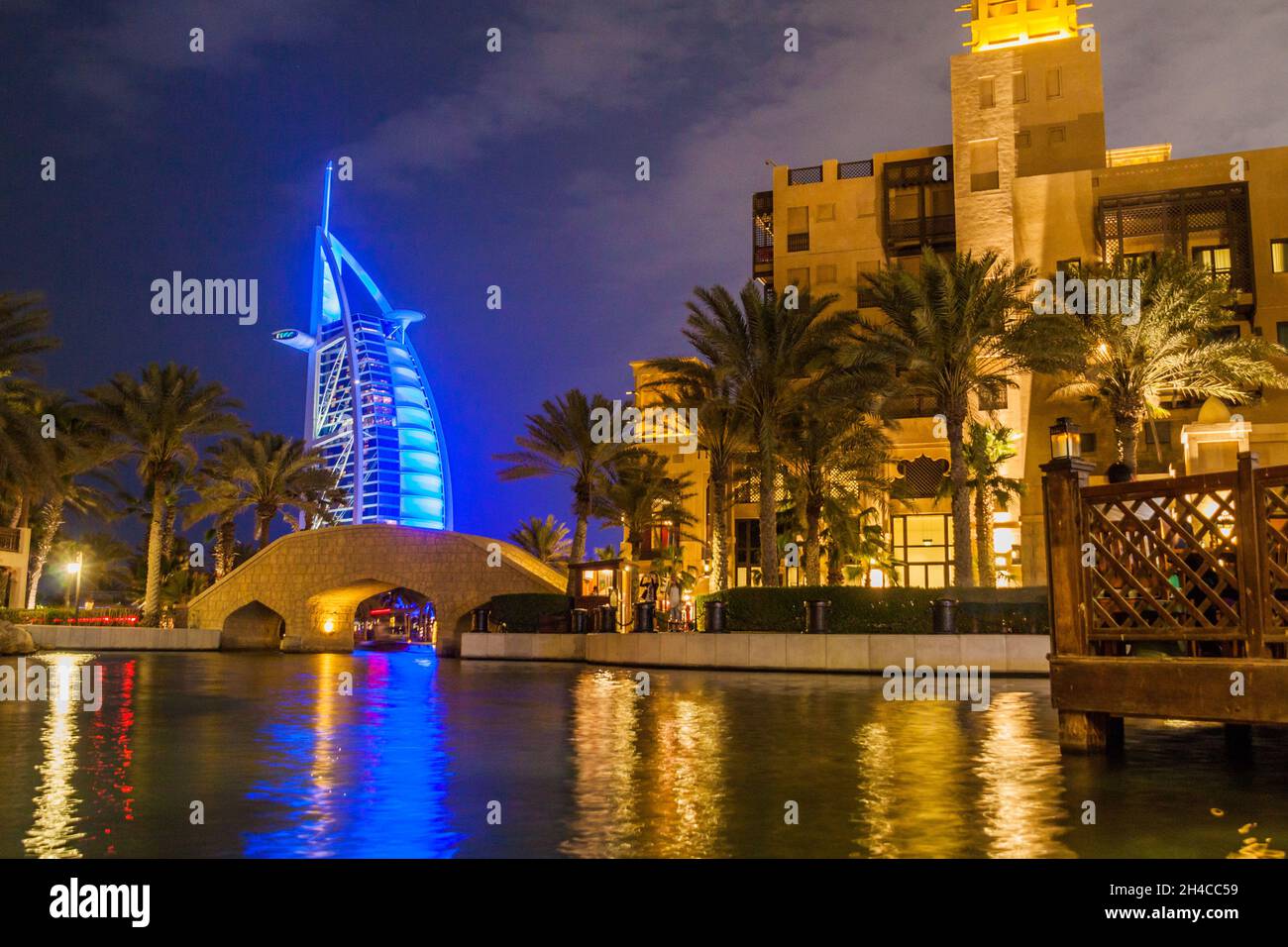 Night view of Burj Al Arab Tower of the Arabs seen from Madinat Jumeirah in Dubai, United Arab Emirates Stock Photo