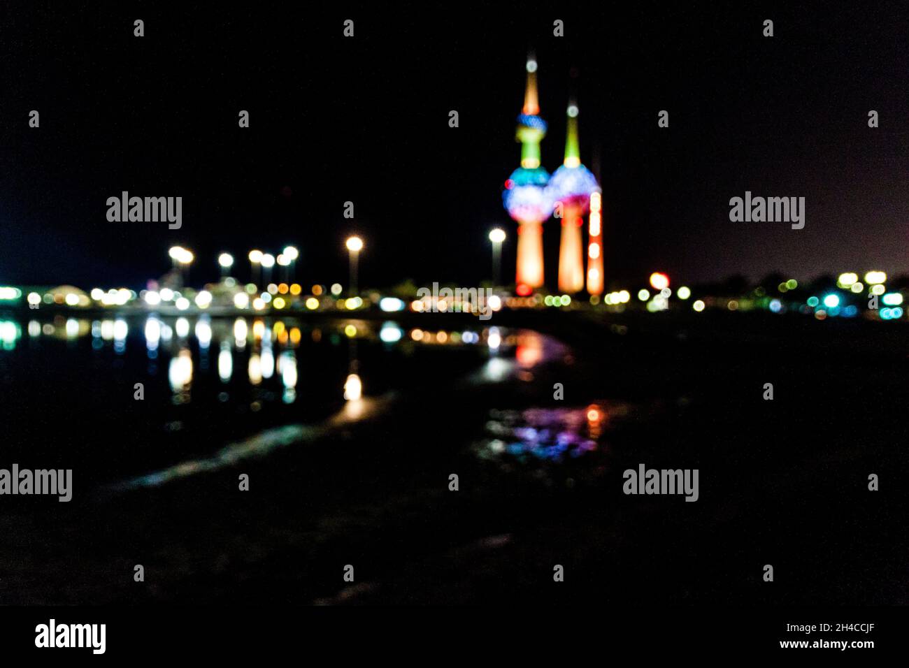 Blurred lights of Kuwait City with Kuwait Towers Stock Photo