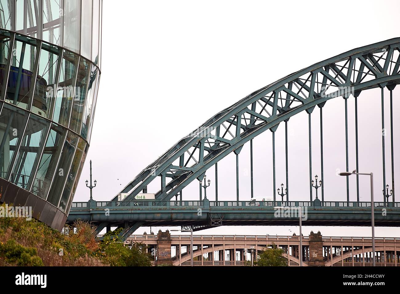 Newcastle upon Tyne Quayside area framed by the Sage Gateshead waterfront concert venue Stock Photo