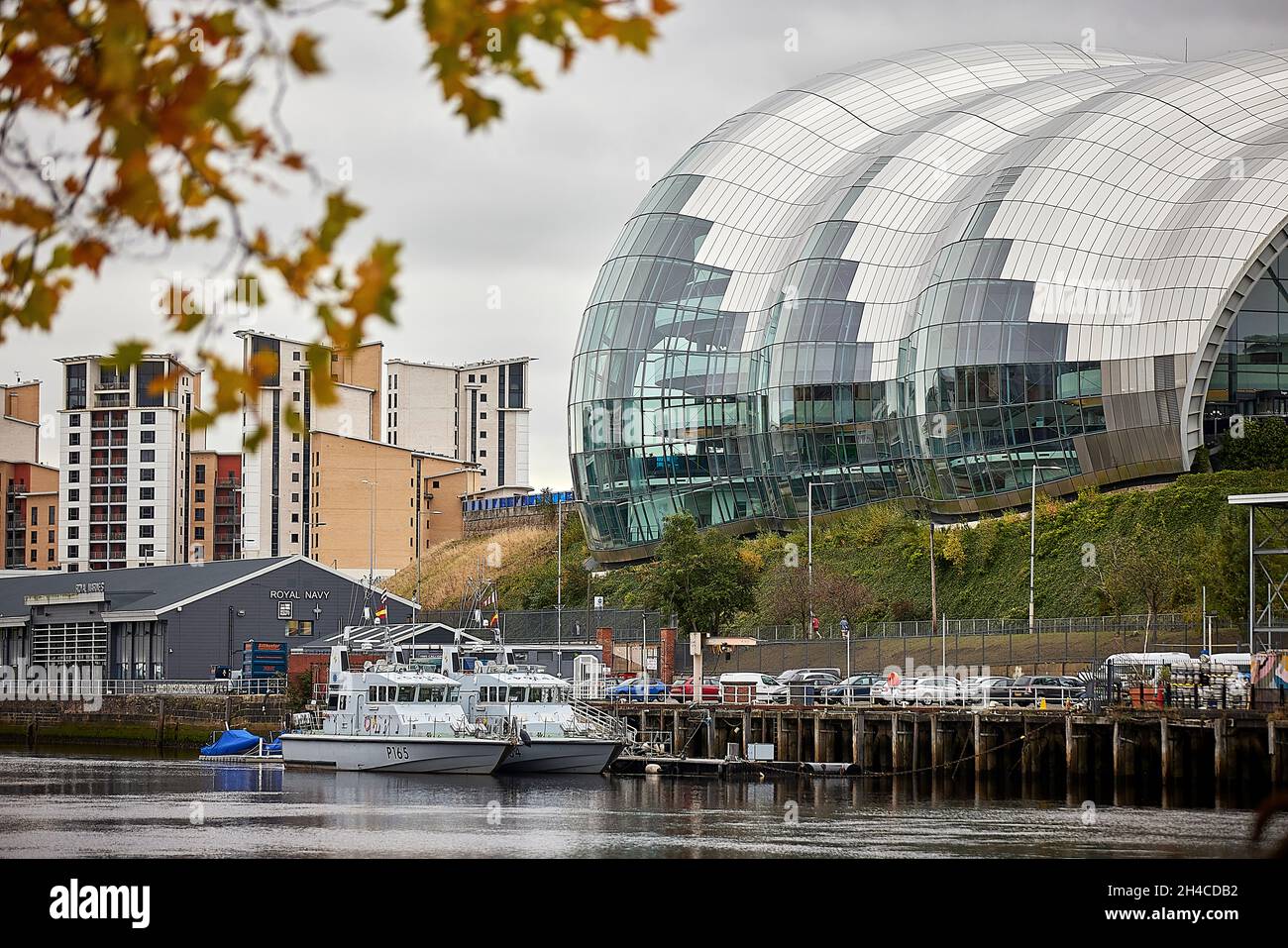 Newcastle upon Tyne Quayside area framed by the Sage Gateshead waterfront concert venue and Baltic Quay apartments Stock Photo