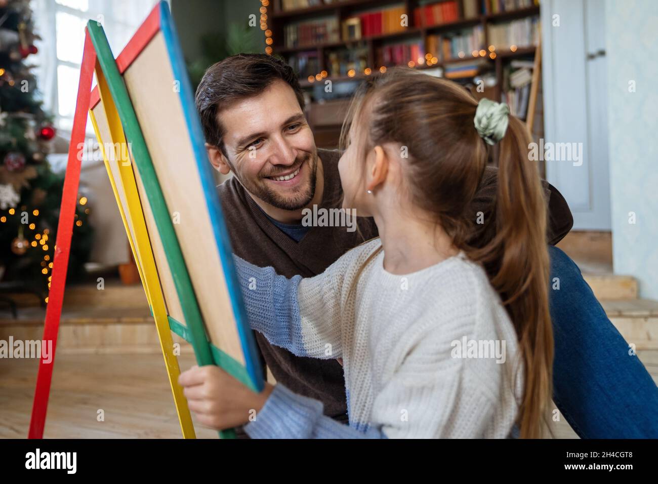 Happy father and his daughter spending quality time together at home Stock Photo