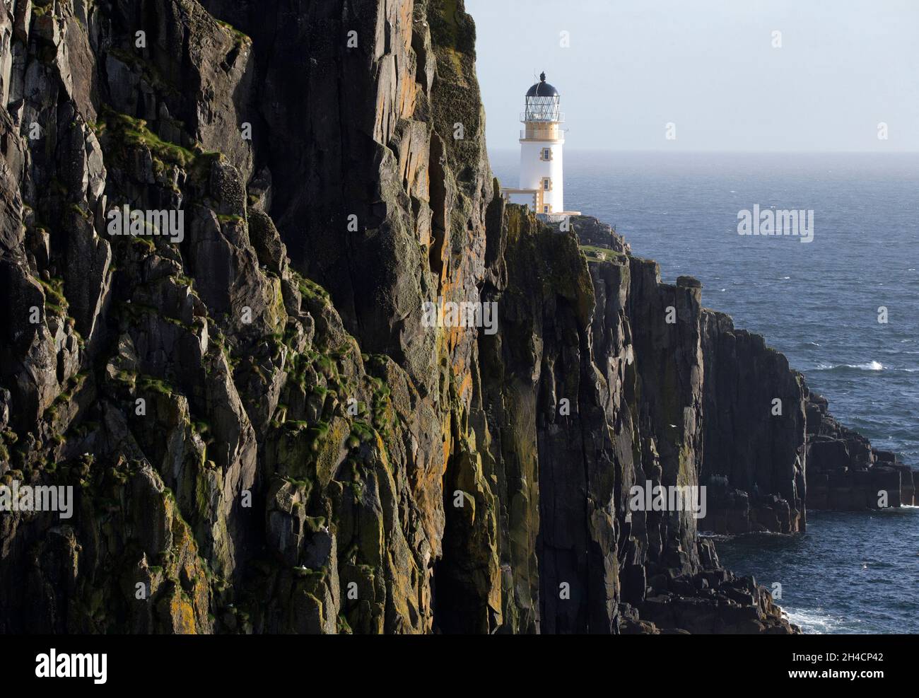Basalt rock formations. Neist Point Lighthouse Stock Photo