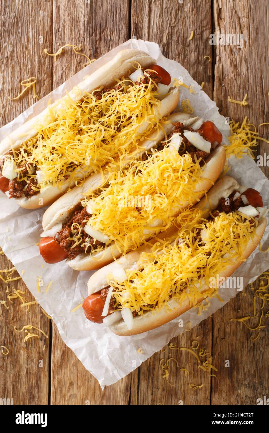 Tasty homemade Cincinnati Chili hot dog with beef sausage, cheddar